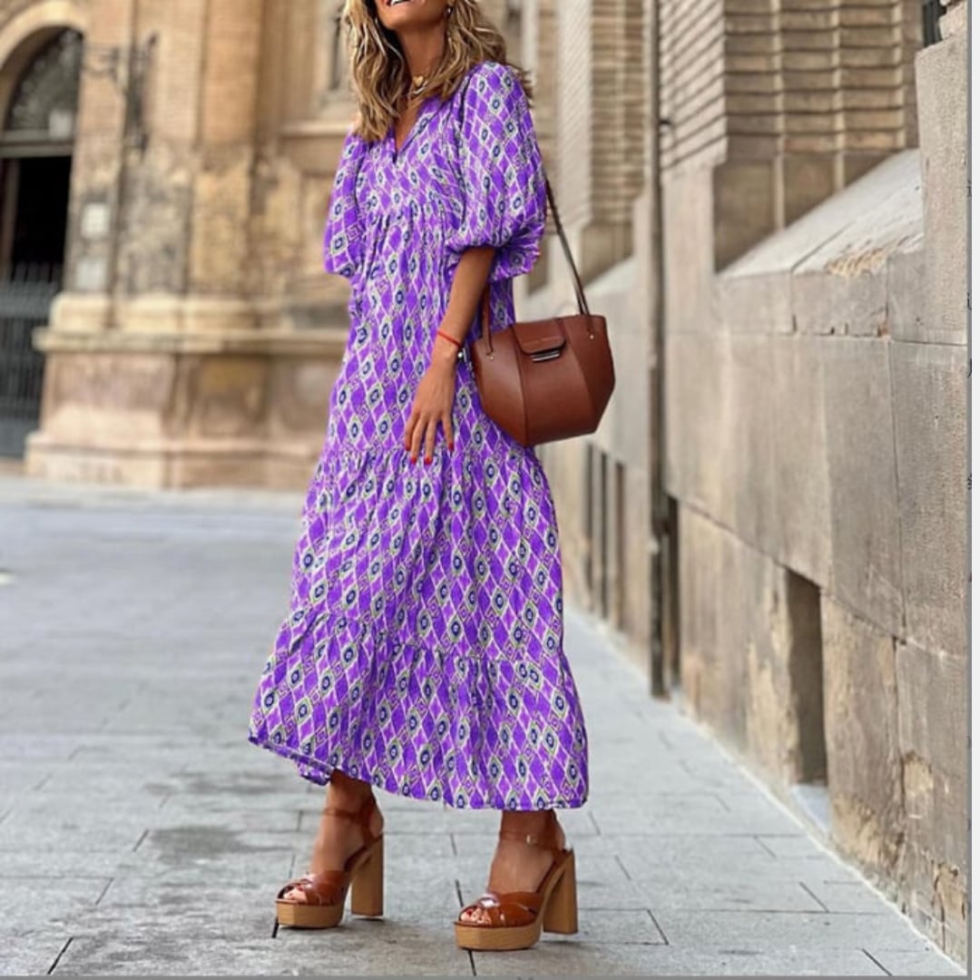 Flora boho maxi dress flat lay showing puff sleeves and full skirt shape