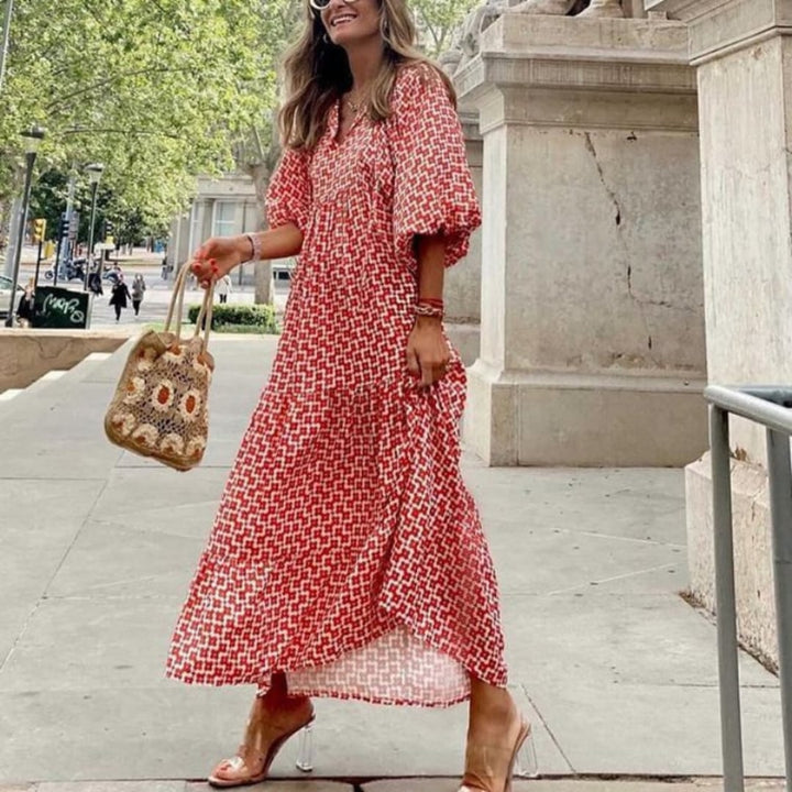 Woman in Flora boho maxi dress in pink at outdoor daytime setting