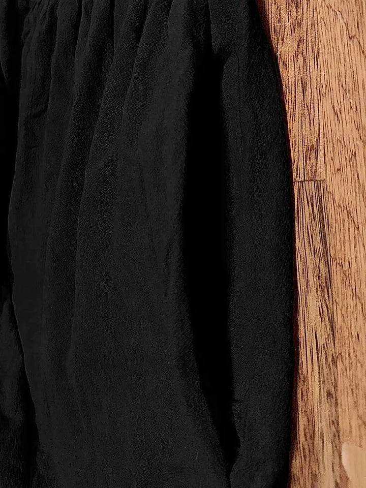 Close-up detail of the Florence dress fabric texture and minimalist design