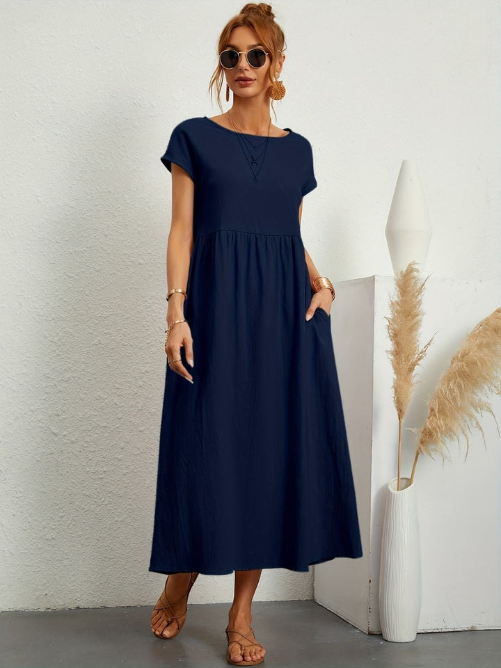 Model styled with sandals wearing the Florence lightweight dress outdoors