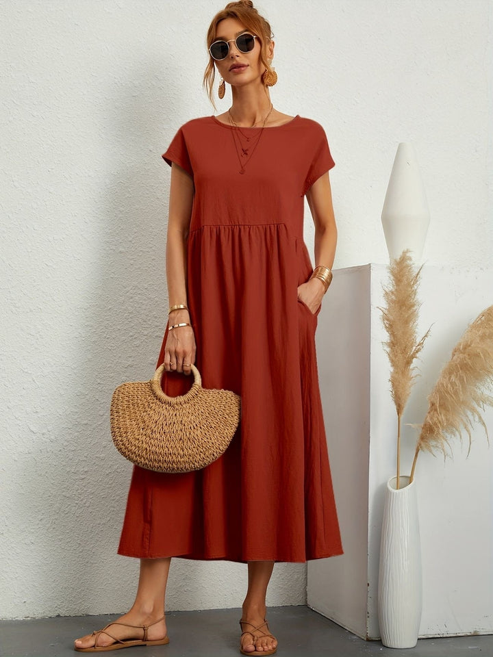 Florence dress shown in red colorway on a model