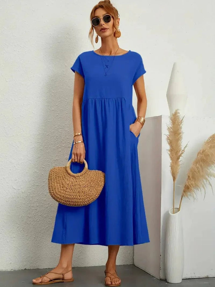 Florence dress shown in pink colorway highlighting the flattering silhouette