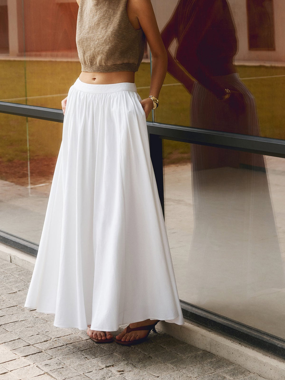 Florence white maxi skirt showing full A-line silhouette and floor-length hem