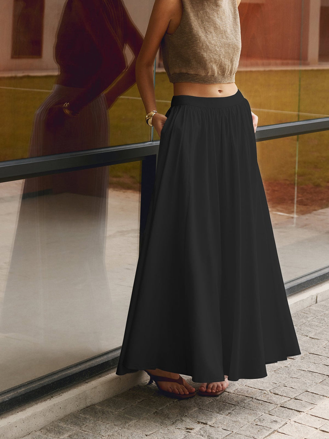 Close-up of pleated waistband on Florence black maxi skirt