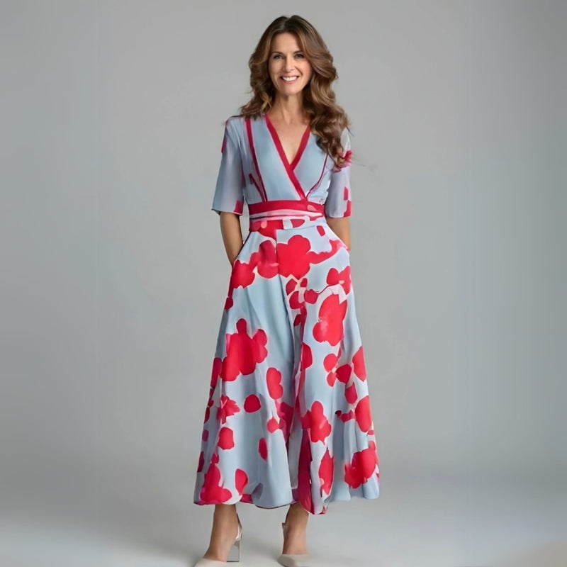 Woman wearing a floral wrap dress with a cinched waist and flowing skirt in a soft floral print