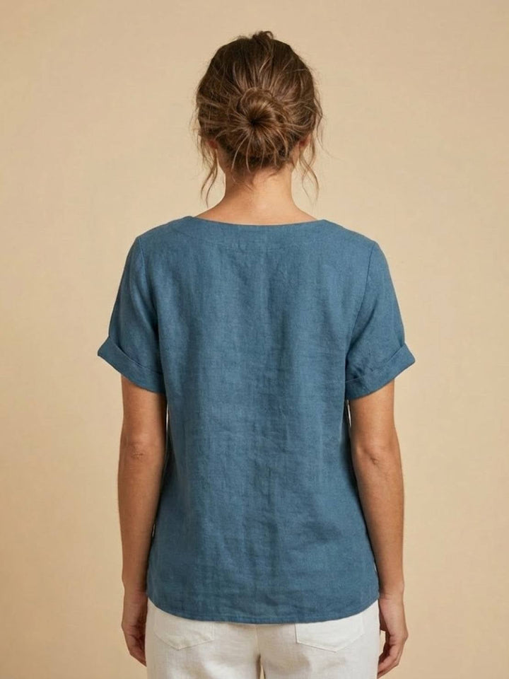 Model wearing Foreen casual top in Navy Blue tucked into wide-leg trousers