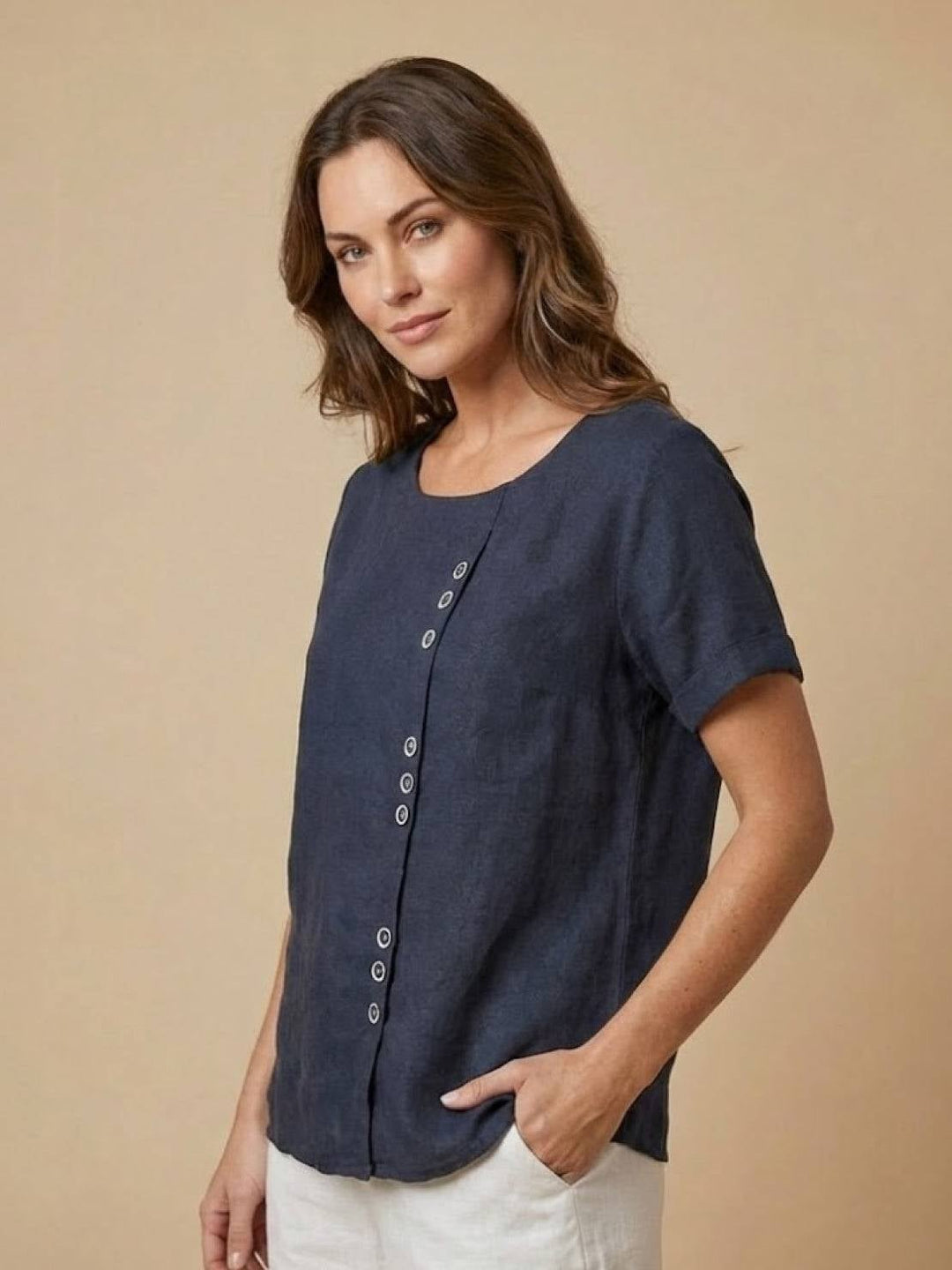 Close-up of asymmetric button column on Foreen top in White