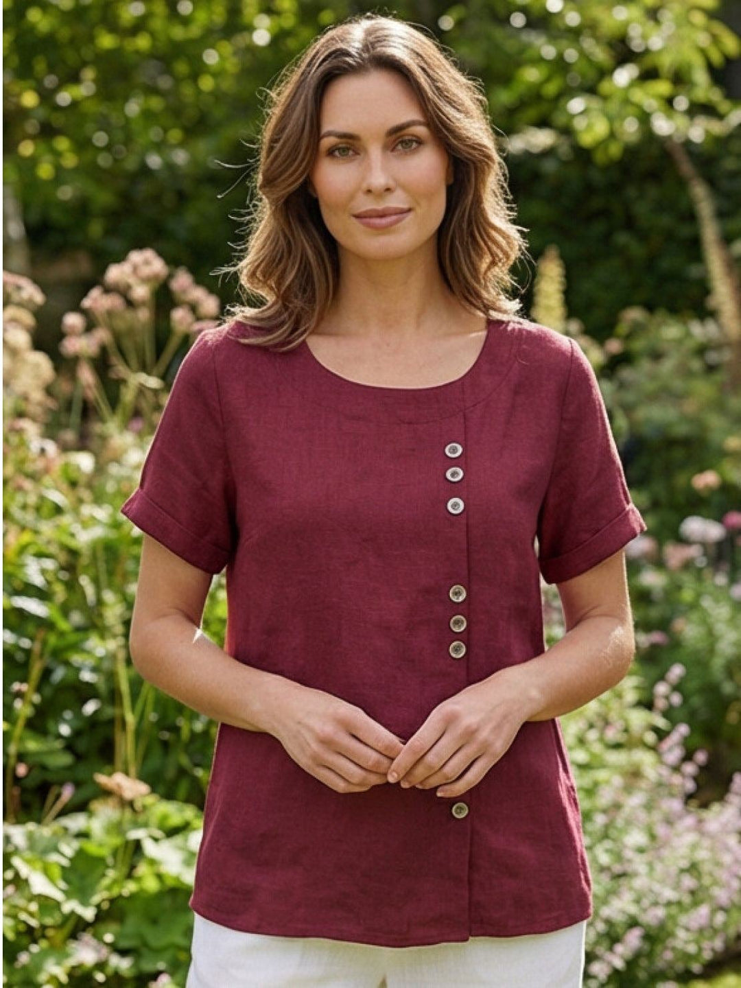 Flat lay of Foreen top in Deep Teal highlighting button column and cuffed sleeves
