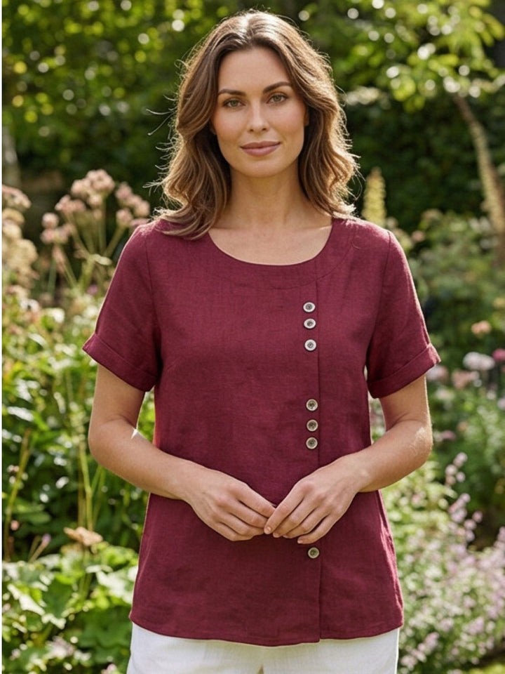 Flat lay of Foreen top in Deep Teal highlighting button column and cuffed sleeves