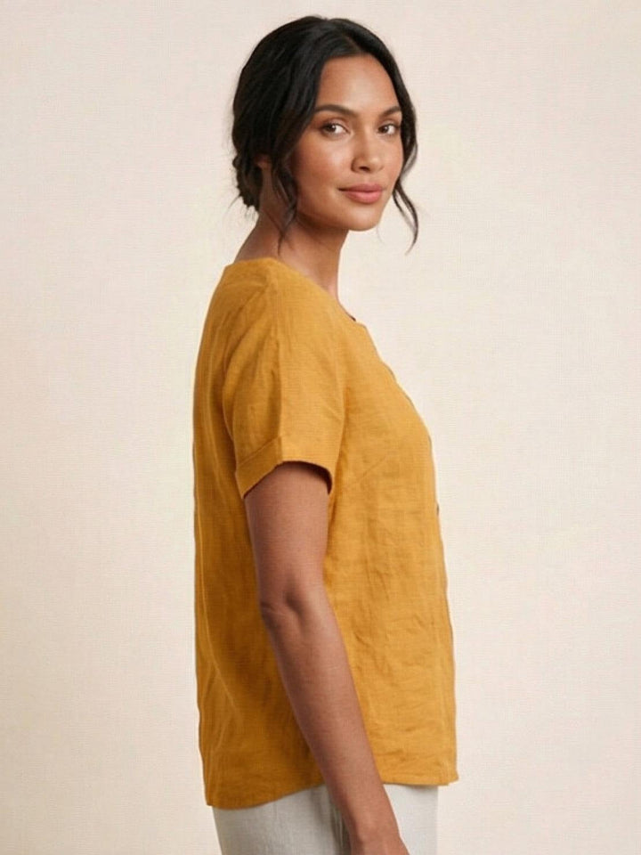 Model wearing Foreen top in Army Green from behind with relaxed silhouette