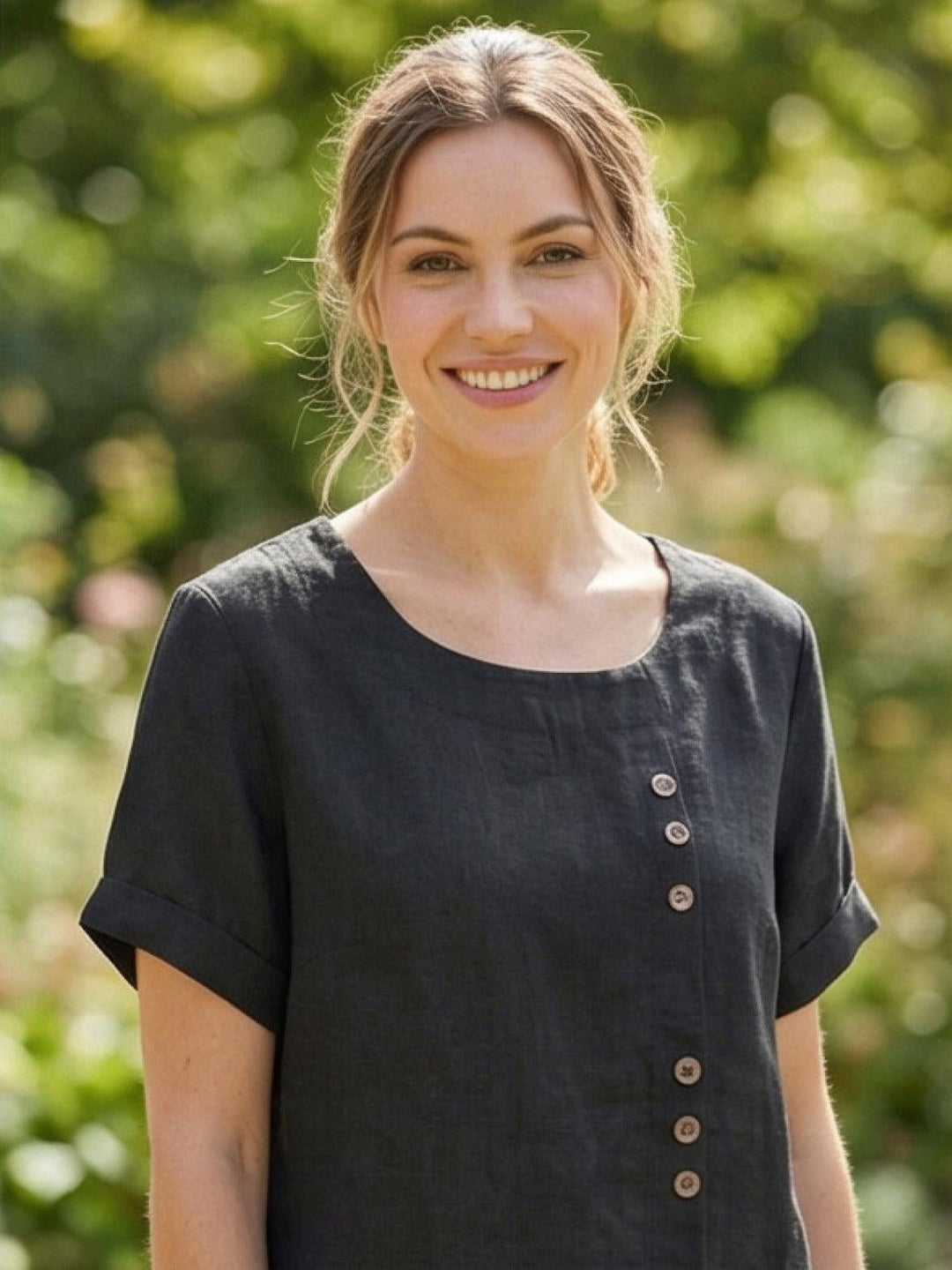 Model wearing Foreen button top in Deep Teal from three-quarter angle