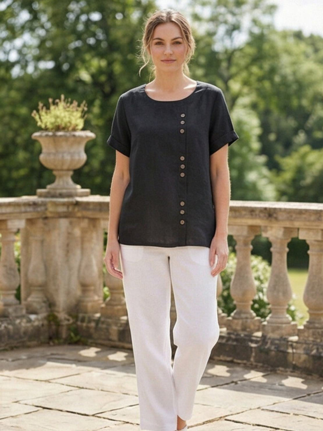 Model wearing Foreen scoop neck top in Coffee Brown showing cuffed sleeve detail