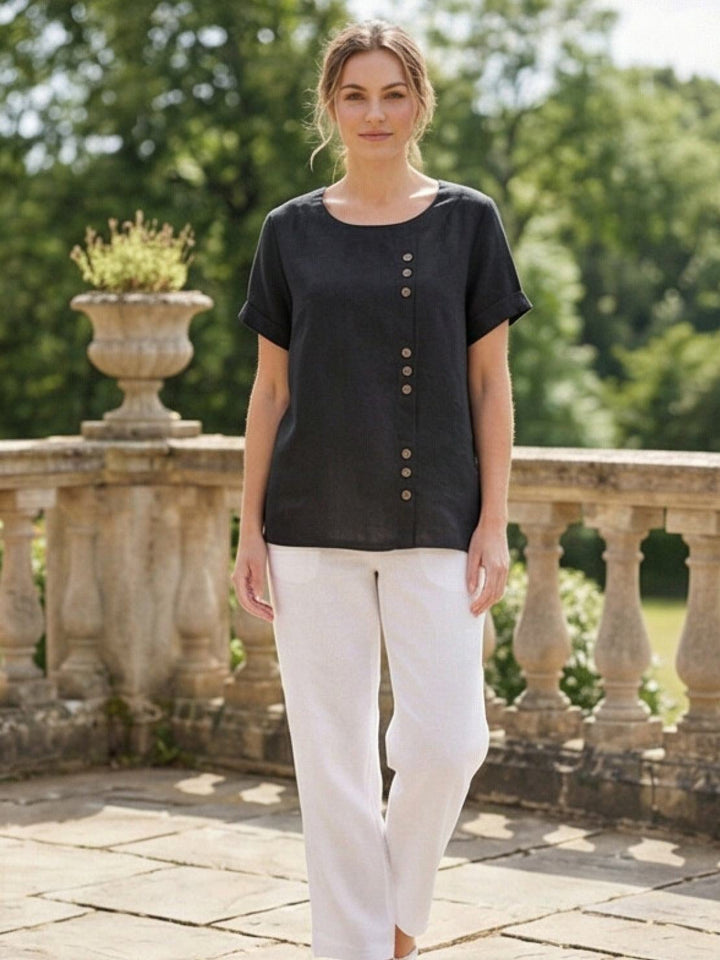 Model wearing Foreen scoop neck top in Coffee Brown showing cuffed sleeve detail