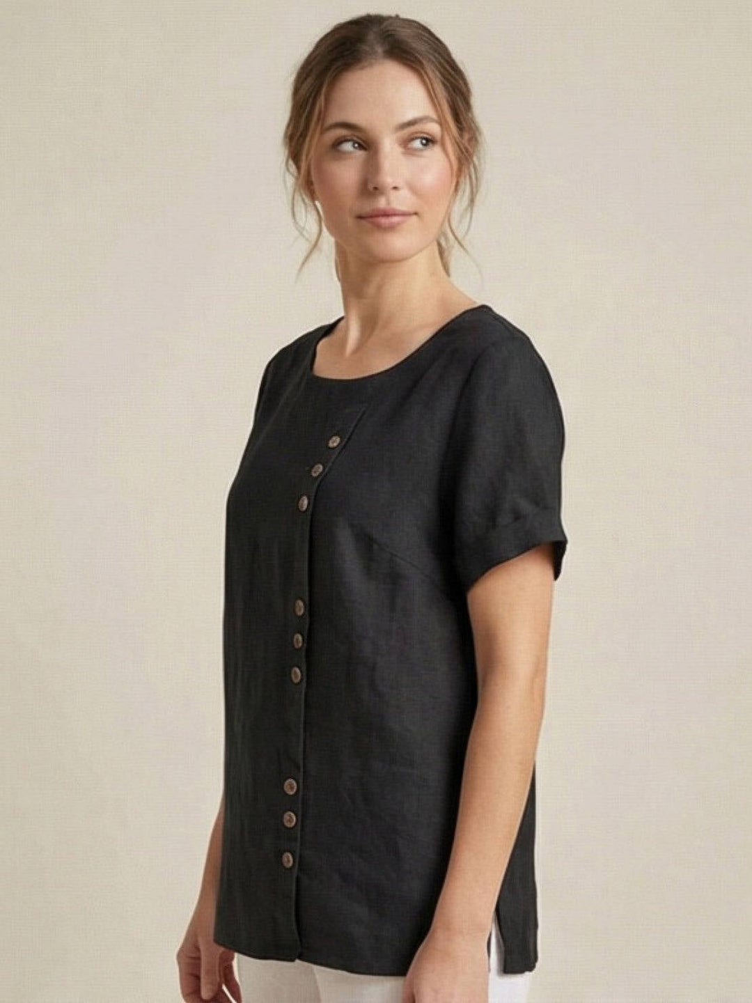 Model wearing Foreen casual top in Light Pink with pendant necklace