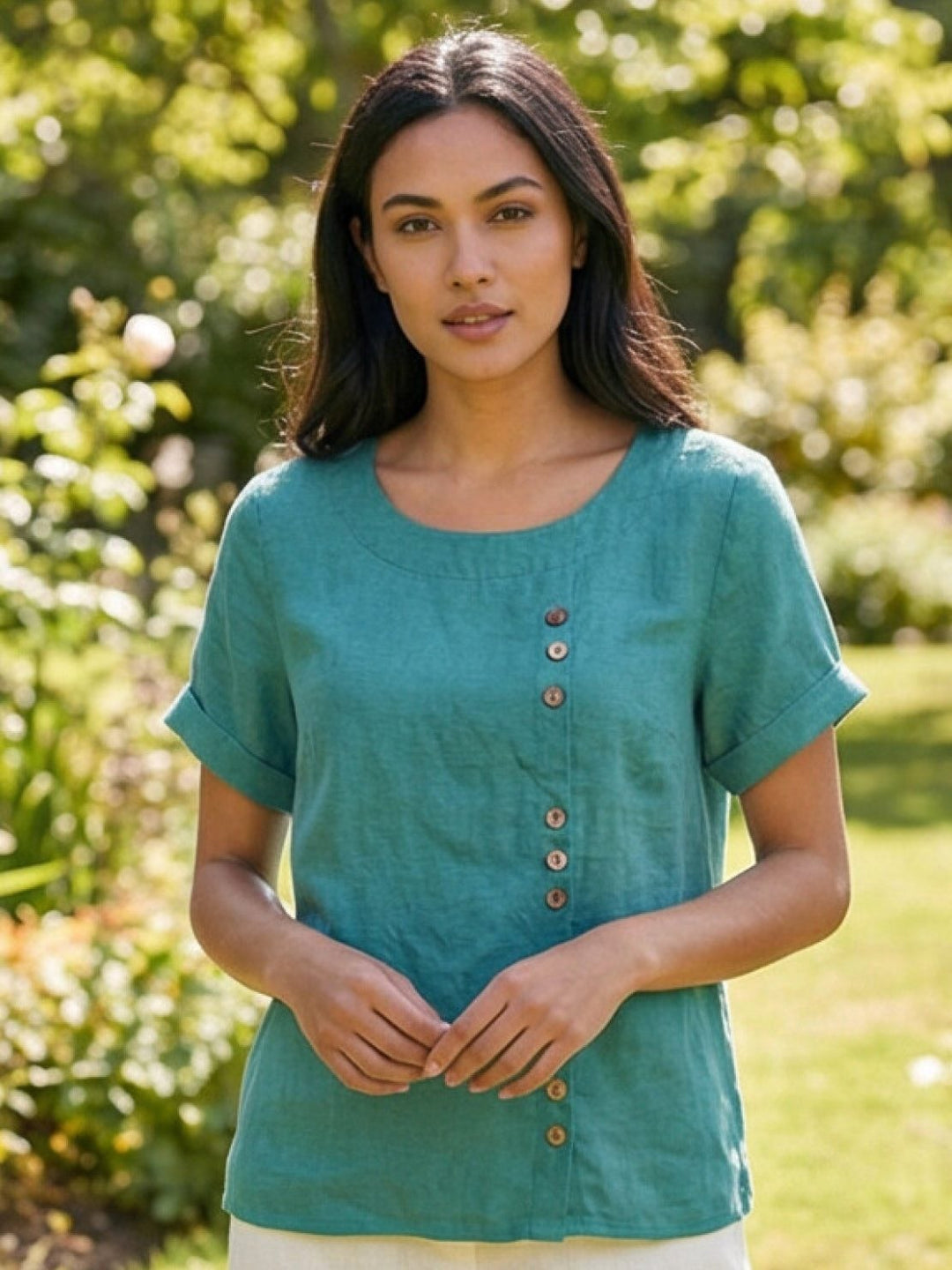 Detail shot of rolled cuff sleeve on Foreen short sleeve top