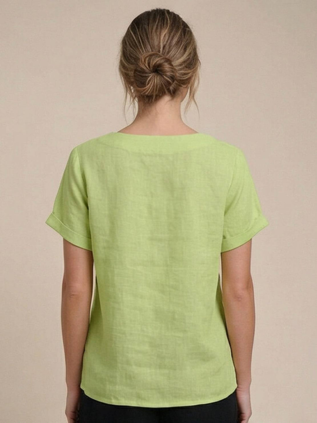 Close-up of drop-shoulder seam and cuffed sleeve on Foreen casual top in Navy Blue