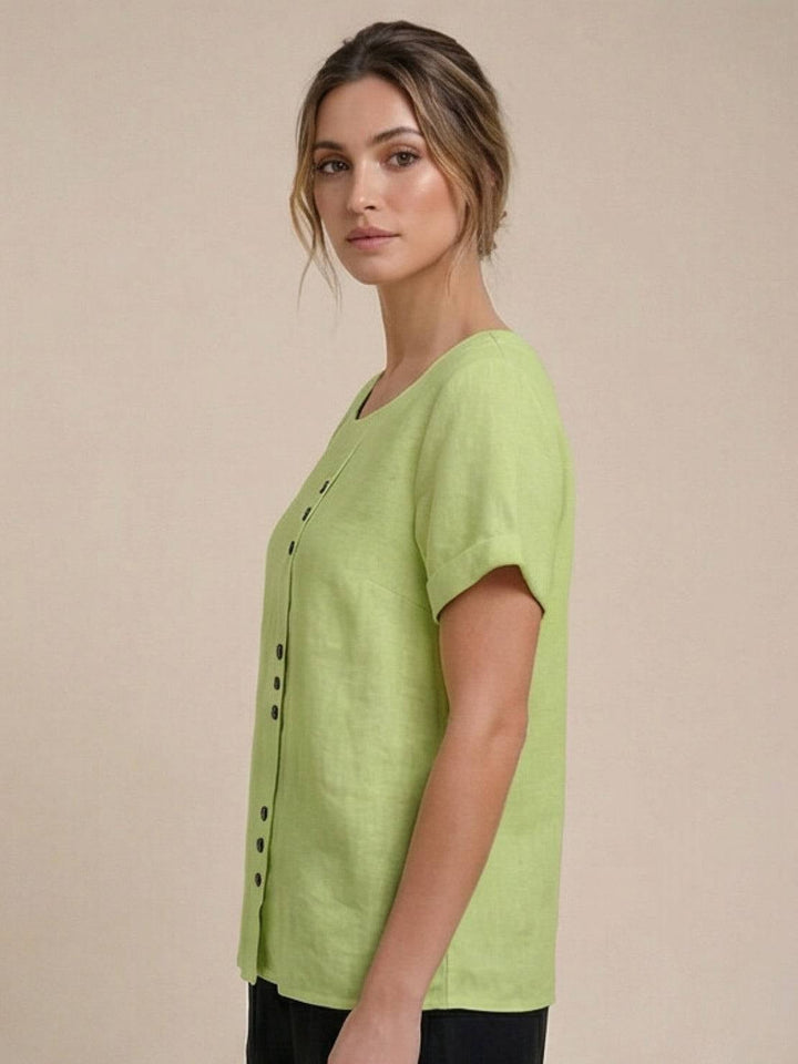 Foreen scoop neck short sleeve top in Orange styled with denim for casual warm-weather look
