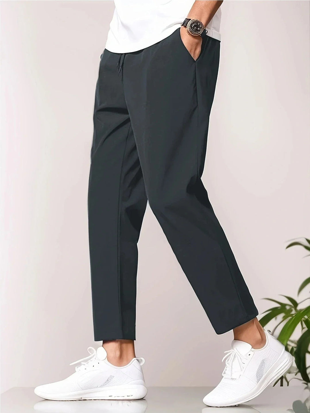 Deep blue lightweight casual pants laid flat showing full length and relaxed silhouette
