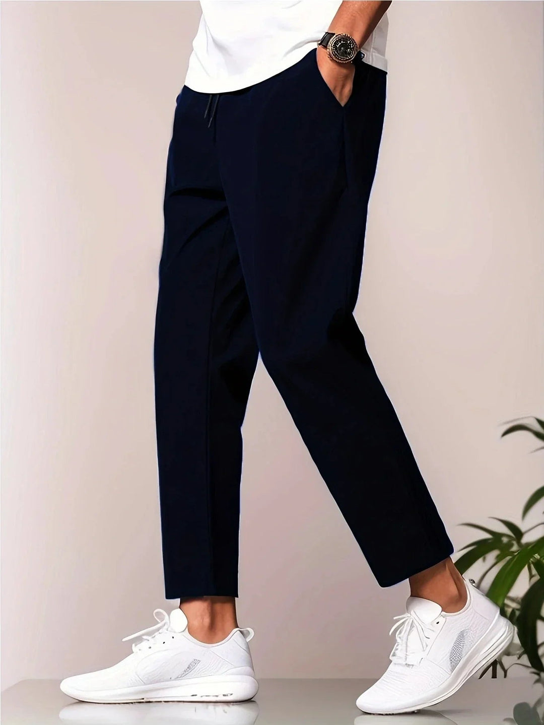 Back view of grey relaxed-fit casual pants showing clean tailored finish