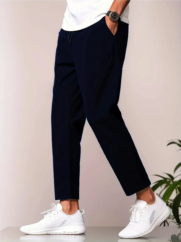 Back view of grey relaxed-fit casual pants showing clean tailored finish