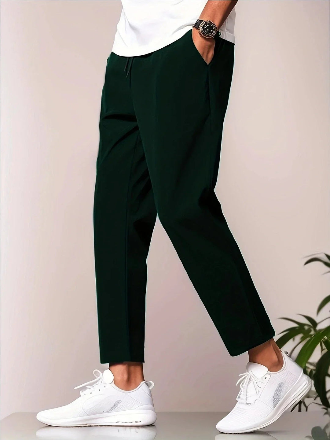 Flat lay of all three color options — grey, black, and deep blue — of lightweight casual pants