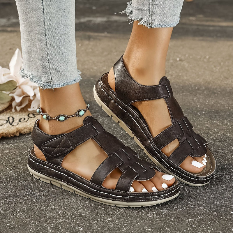 Close-up of Foxglove sandal straps in green showing secure fit