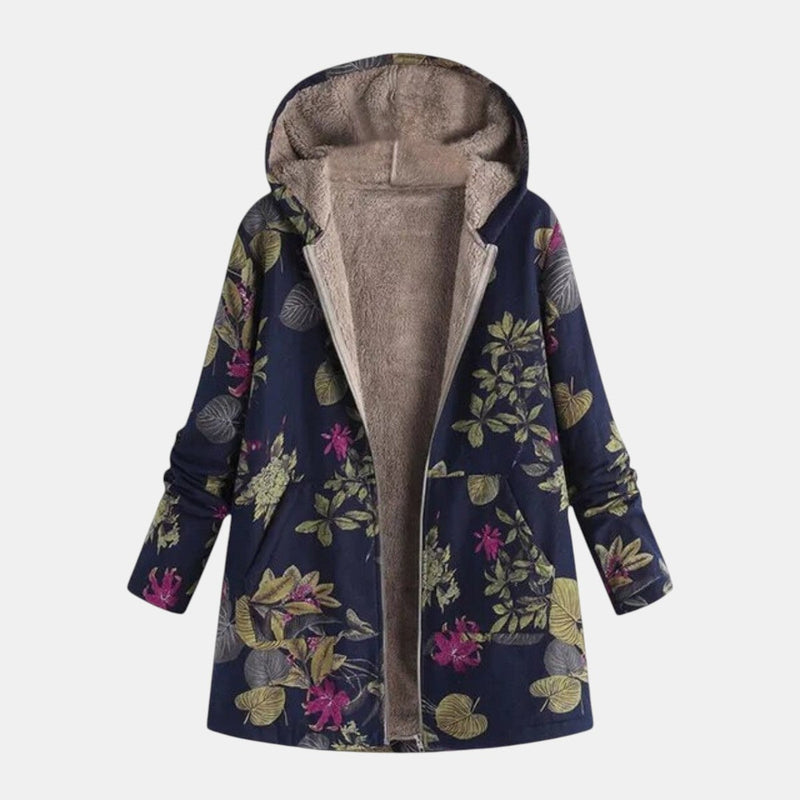 Woman wearing the Frances cozy elegant coat in dark blue, featuring a tailored silhouette and soft premium fabric