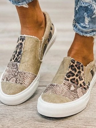 Frances slip-on shoes in black displayed on a neutral surface highlighting the flexible upper