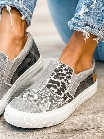 Woman standing in Frances slip-on shoes in gray, full-length lifestyle shot