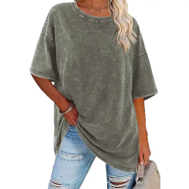 Army green oversized vintage tee on model showing full-length relaxed fit