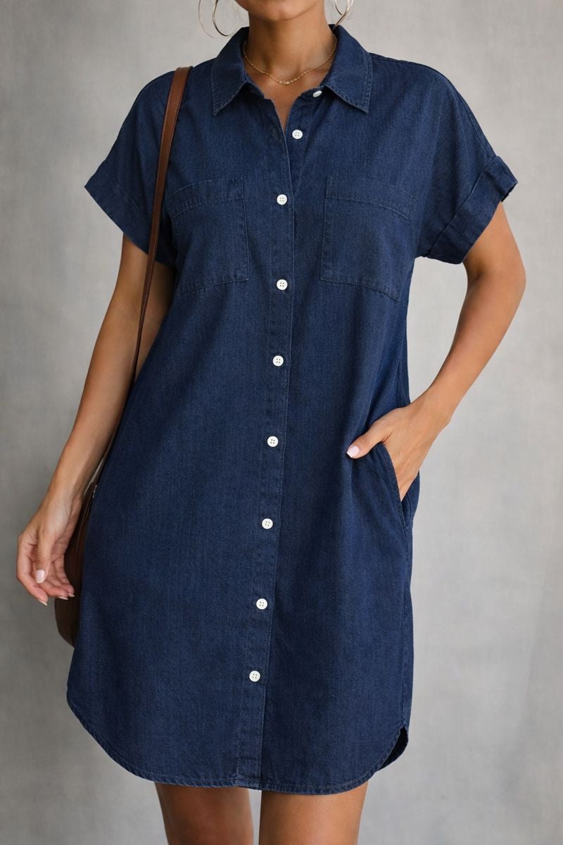 Side profile of the Francesca denim dress in dark blue, showcasing the smooth midsection and feminine shape