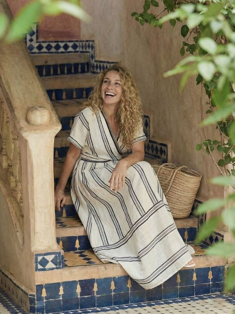 Back view of the Francesca white striped wrap midi dress showing the relaxed drape
