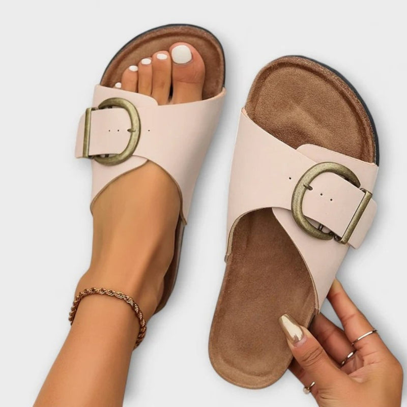 Freesia women's orthopedic sandal in black with cushioned sole and slim adjustable straps, side profile view