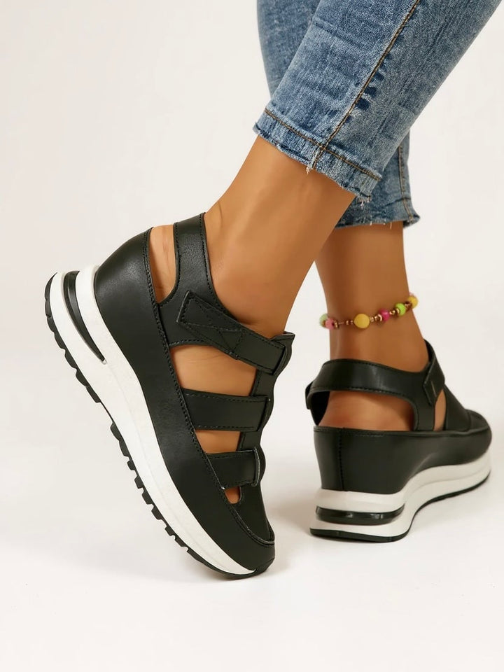 Freesia women's black platform sandals, close-up of strap buckle detail