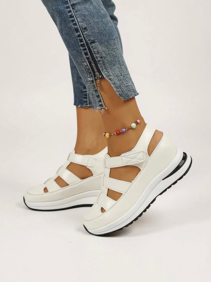 Freesia platform sandals in white, black, and camel displayed together