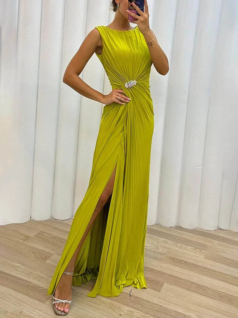 Woman wearing a yellow pleated maxi dress with flowing silhouette, perfect for wedding guests and formal occasions