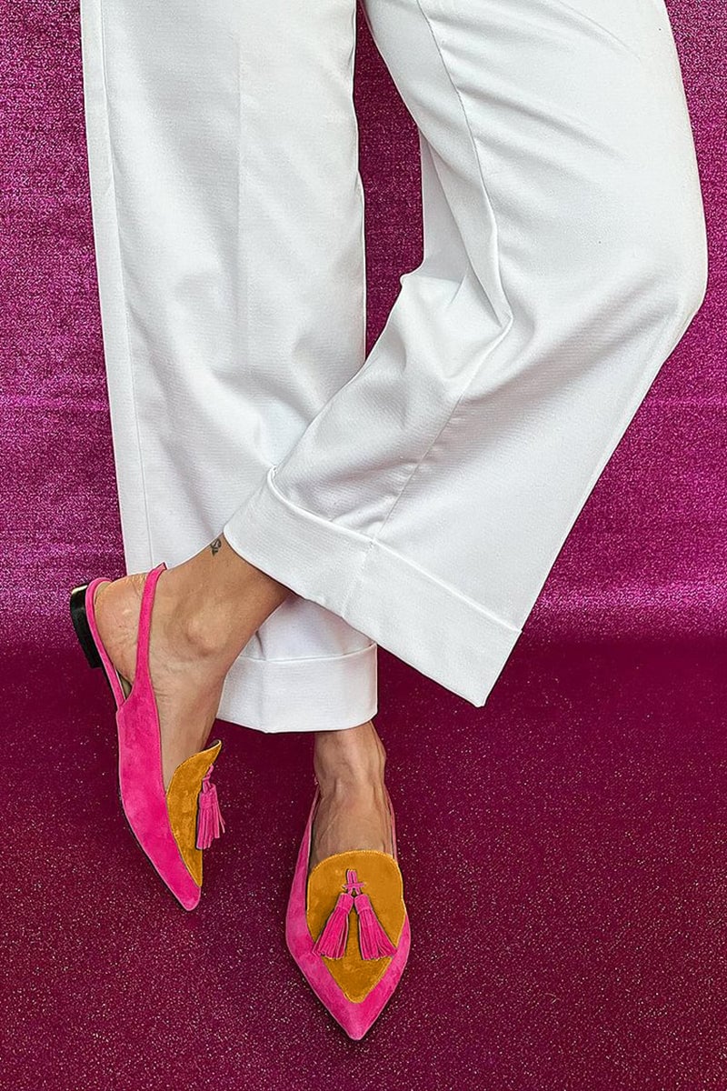 Side view of fringe ballet flats highlighting the ankle strap detail and lightweight sole construction