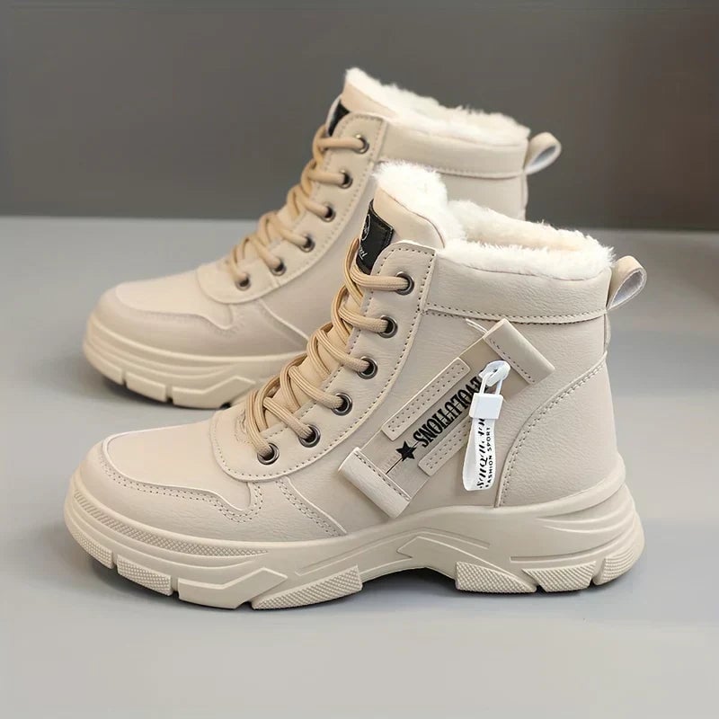Freya comfort boots in a sleek silhouette, shown from the front in a neutral colorway