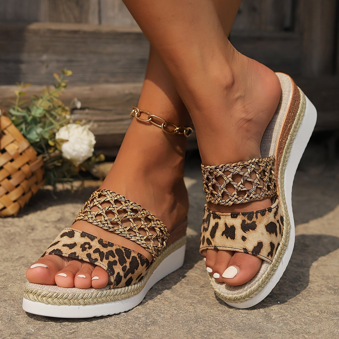 Freya woven wedge sandals in black, front angle showing wedge sole