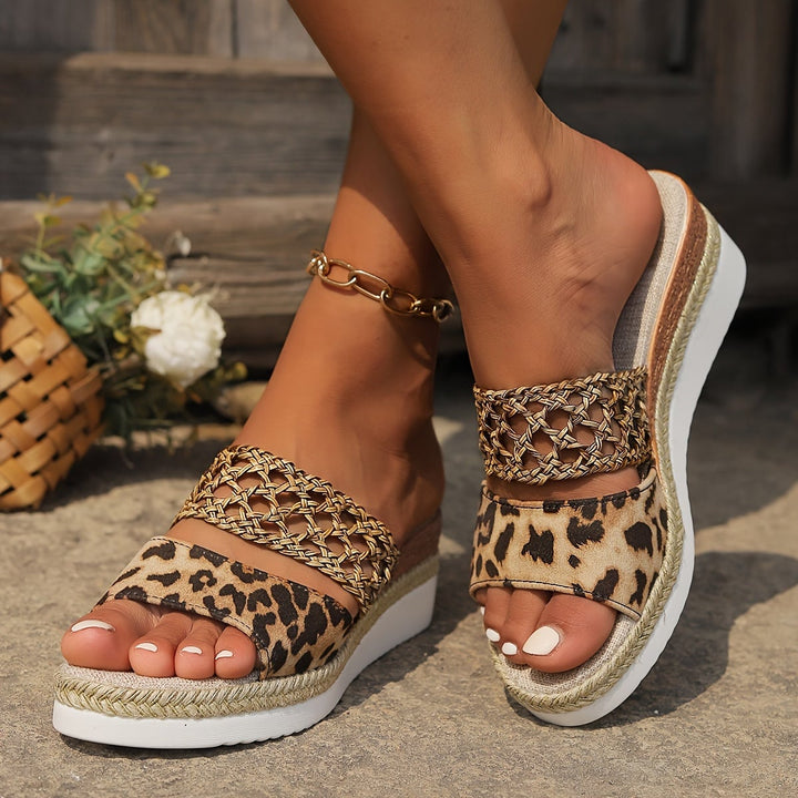Freya woven wedge sandals in black, front angle showing wedge sole