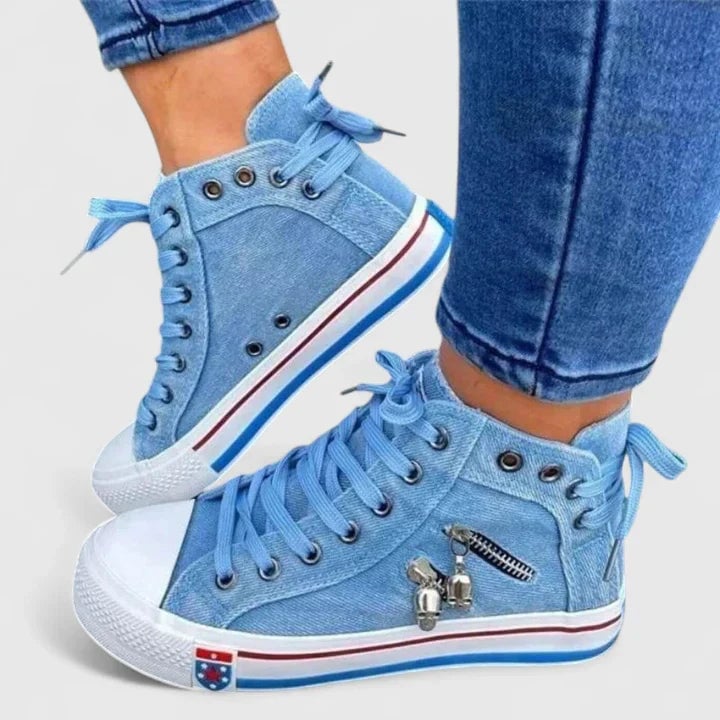 Freya denim blue high-top lace-up sneaker with side zip and red and blue stripe midsole, front view