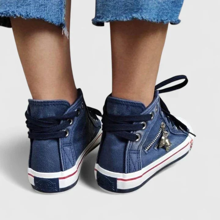 Rear view of Freya denim high-top sneaker showing ankle collar and flat lace-up closure
