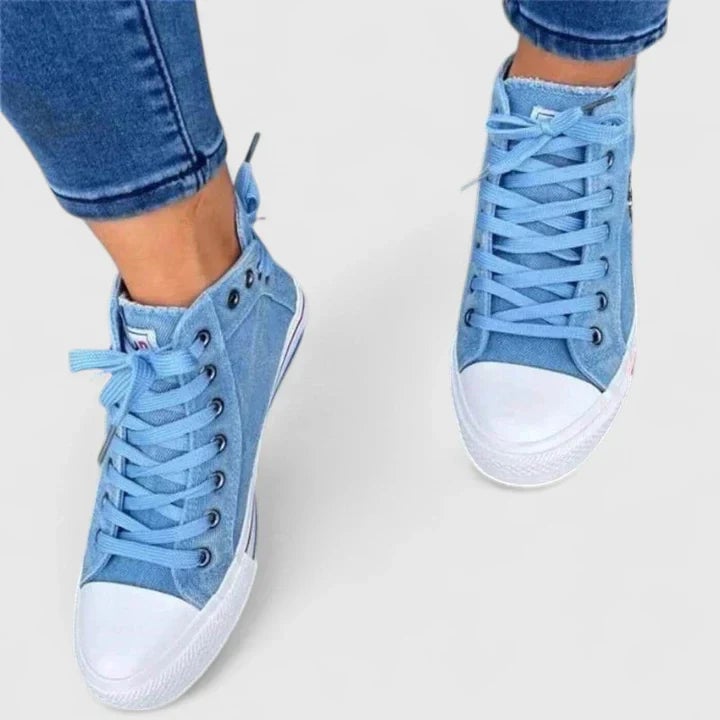 Freya navy blue high-top lace-up sneaker with side zip and sporty stripe midsole, front view