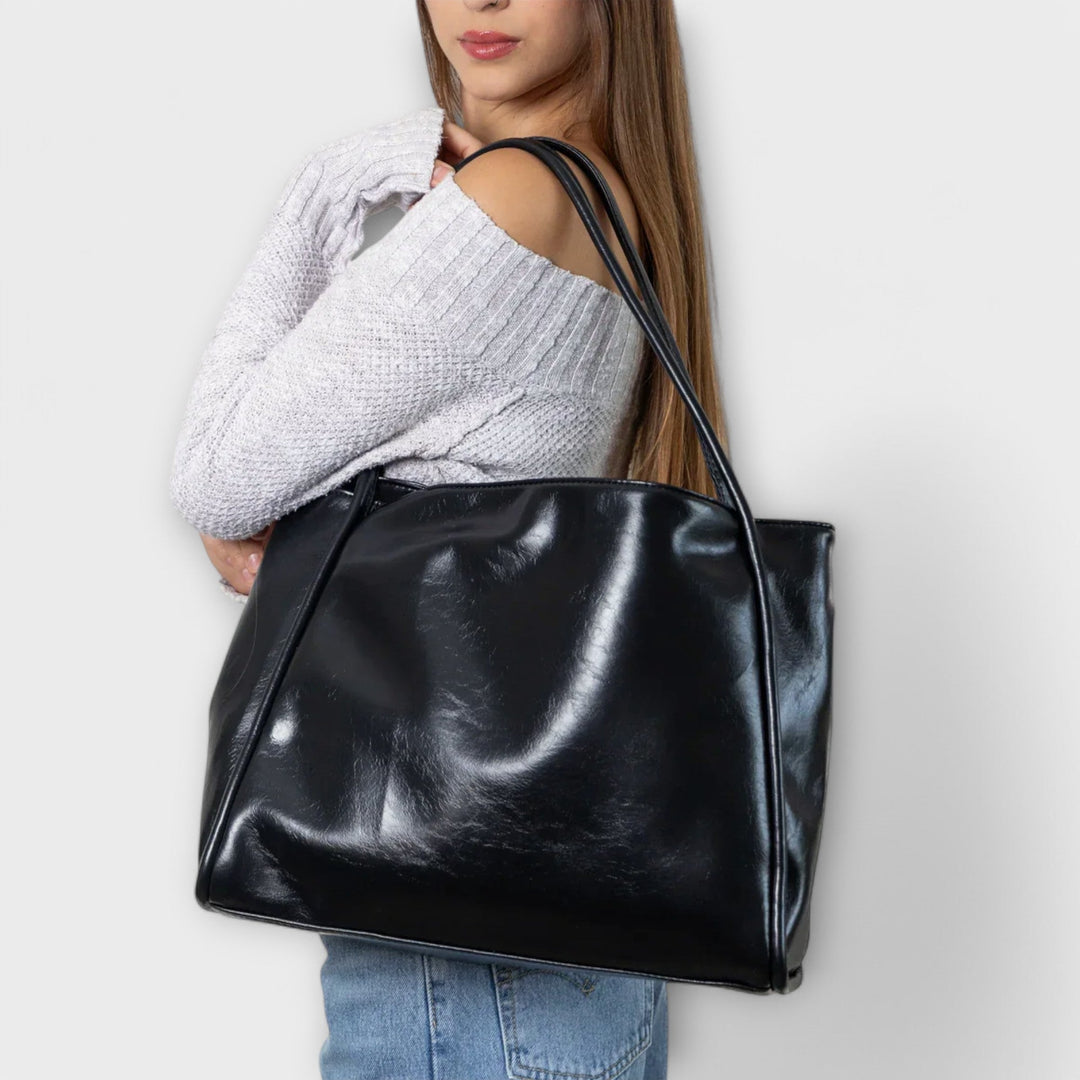 Freydis handbag in dark brown showing structured shape and shoulder straps