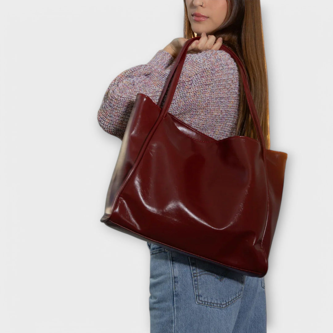 Freydis structured handbag top handle and strap detail