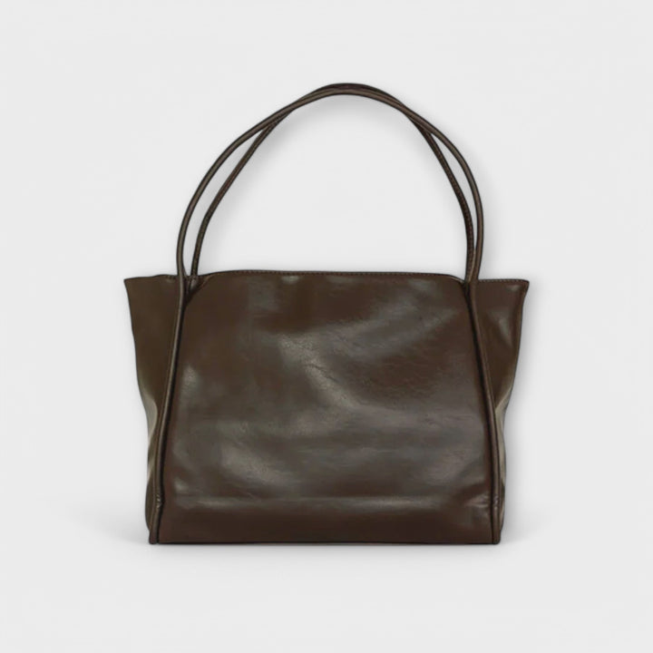 Freydis handbag in dark brown on neutral background