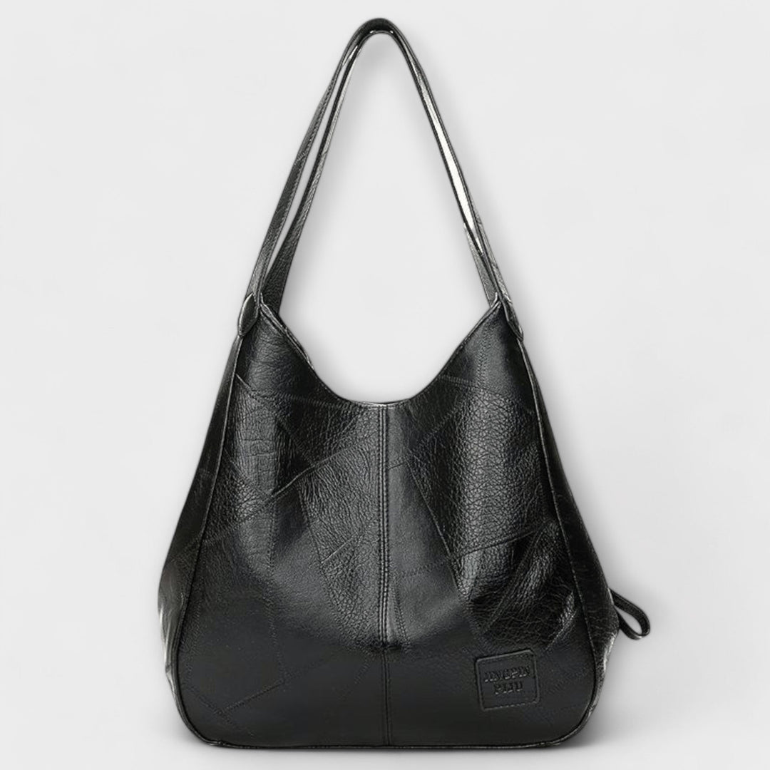 Shoulder bag in red styled with a casual everyday outfit