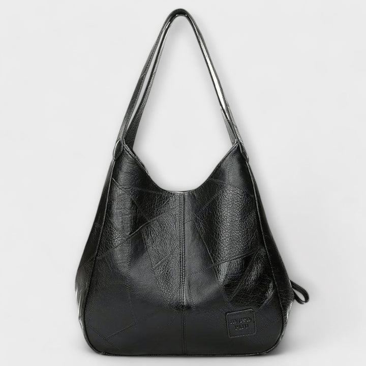 Shoulder bag in red styled with a casual everyday outfit