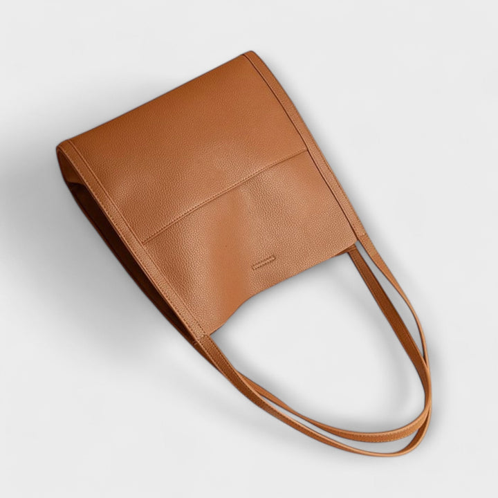 Freydis structured handbag in Red colorway on a neutral background
