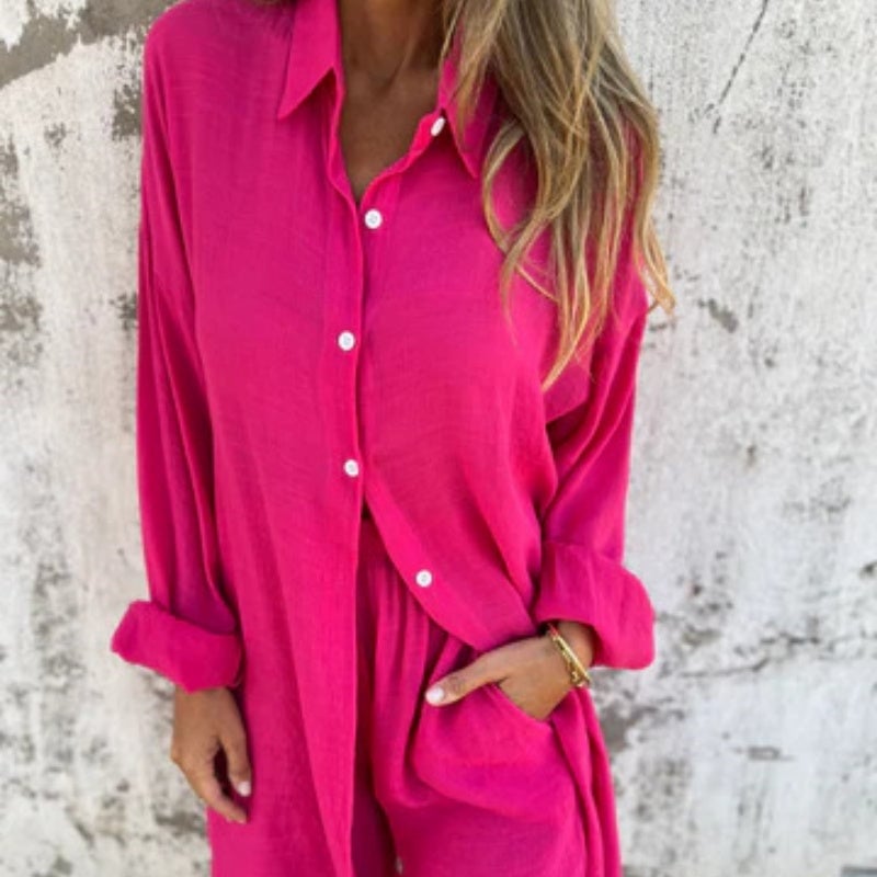 Close-up of the Funa button-up blouse lapel and button detail in blue